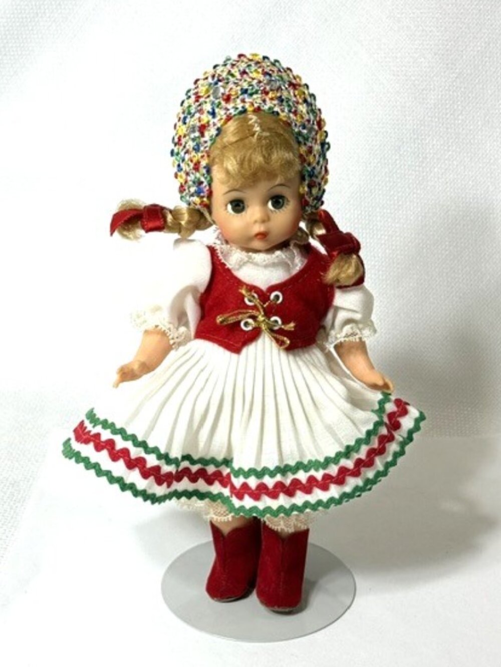 Madame Alexander restrung 8" Poland doll with stand.